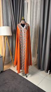 A rich amber-orange shade Abaya