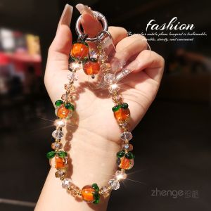 สร้อยข้อมือคริสตัลหินลูกปัดสไตล์เก๋ไก๋สำหรับผู้หญิง จี้โทรศัพท์มือถือ กระเป๋า หัวเข็มขัดกุญแจใหม่ ดีไซน์เก๋ไก๋ สไตล์โบราณ วัสดุอะคริลิก