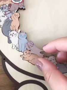 Wooden jigsaw puzzle of cartoon cat an educational toy.