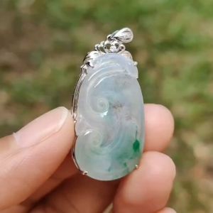 Icy Translucent with Light Green Patches Natural Type A Jadeite Jade crafted with shape of Ruyi set on 18k Gold as Pendant certificate weighs 4.01 grams measurement 37.6 * 18 * 5.5 mm (18kp51)
