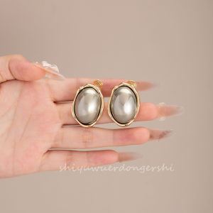 Elegant Oval Pearl Ear Studs Fashionable Wave Edge Unusual Metal Design No Piercing Required Mosquito Coil Womens Jewelry