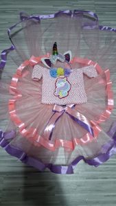 Unicorn dress with tutu skirt and headband for children. Pink crochet top with unicorn applique layered tulle skirt with pink and purple ribbons and matching unicorn headband with horn and ears.