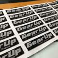 GEAR UP Logo Emblem Original Design Perodua Bezza Acia Myvi Ativa Alza Aruz Kancil Kelisa Kenali Kembara   Size: 7cm x 1.6cm  Ukuran: 70 x 16mm  Sticker 3M Original Design Perodua Emblem. 