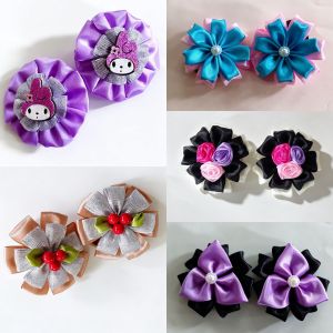 Black and pink flower ponytails with purple accents for kids hairstyles.