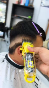 Portable rechargeable electric hair clipper with LCD display of battery level and razor.