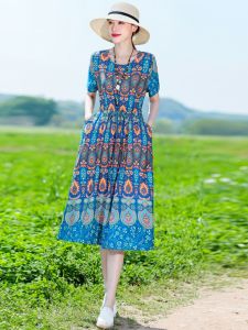 ชุดเดรสยาวผ้าไหมคอตตอนปลอมพิมพ์ลายดอกไม้ทรงหลวมสบายๆ สำหรับฤดูร้อน เดรสยาวปานกลางสไตล์วันหยุดชายหาด