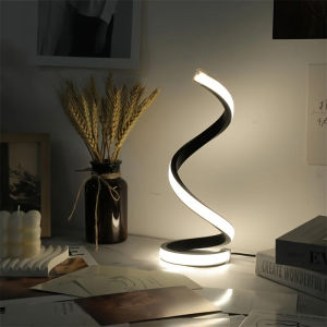 A modern elegant white spiral desktop lamp powered by USB with three-color dimming suitable for various types of rooms.