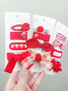 Set 4 kẹp nơ vải len D82 tông màu đỏ rực rỡ cho bé gái TTNTD82
