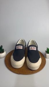 SEPATU SNEAKERS SLIP ON PRIA WANITA HITAM PUTIH SEPATU COWO KEREN BUAT GAYA SEPATU WANITA TERBARU SEPATU SNEAKER PRIA WANITA SLOP SEPATU SEKOLAH SEPATU KEREN  SEPATU KULIAH SNEAKERS SEPATU PRIA KEREN LAKI LAKI CEWEK CEWE BRAND LOKAL AKNA JATKOPA RAJALELAK