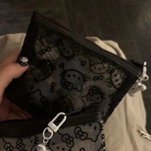2026 New Sanrio Hello Kitty Mesh Material Storage Bag Portable Zipper Coin Purse Creative Earphone Bag Cute Girls Cosmetic Bag