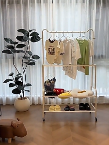 MOD Clothes Hanging Rack Clothes Drying Rack Hanger - White metal frame wheeled with hangers shoes and bags storage suitable for bedroom use.