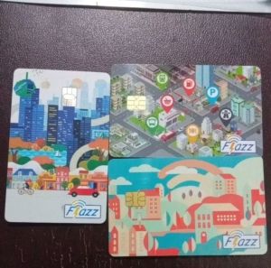 Kartu FLAZZ BCA GEN 2 NFC EMONEY E MONEY NOT MANDIRI E TOLL dengan desain kota modern dan fitur NFC untuk transaksi digital.