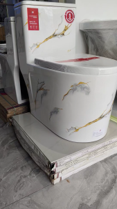 White ceramic toilet with gold and gray marble / Modern bathroom Soft Closing seat and cover