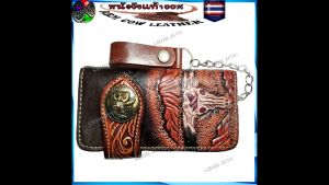 กระเป๋าทรงยาว กระเป๋าเงิน กระเป่าหนัง ลายนก ลายใบ ลายมังกร ติดเหรียญ  ขนาด18 X9.5 ซมเข็มขัดหนังวัวหนังแท้เย็บขอบ งานแฮปวี่ แนวคาวบอย