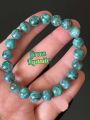 🍀 สร้อยหินไคยาไนต์  สีเขียวอมฟ้า สวยมากๆ ( Green  Kyanite ) 

 สวยเหมือนสีเขียวของมรกต มีติดสีน้ำเงินนิดๆบางเม็ด เหมือนสีของน้ำทะเล 🌊 จะมีความวิบๆวับๆเวลากระทบแสงแดด จากแร่ไมก้า (mica)  ☀️

🍀 Size ลูกปัด 9.2 mm. 
🌊 ขนาดข้อมือ 16.5 cm.. 