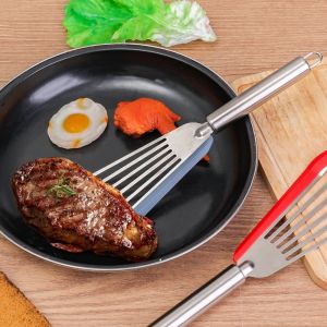 🔥ร้อน🔥อุปกรณ์ทำอาหารในครัวสแตนเลส304ไม้พายปลากันลื่นทัพพีแบบมีรูไม้พายสเต็กอเนกประสงค์สำหรับทอด