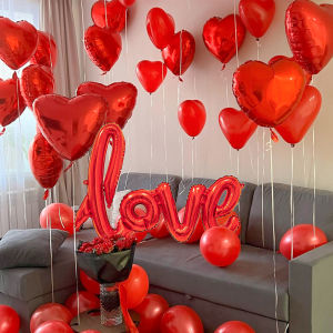 Red conjoined love balloon set with 18 inch heart-shaped balloons and simulated petals for Valentines Day wedding decoration