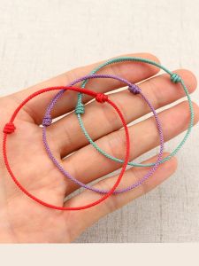 สร้อยข้อมือเชือกแดงทอแบบปรับได้ ปีงู ปีมังกร สไตล์ชาติพันธุ์ สร้อยข้อมือแบบปรับได้สำหรับทั้งชายและหญิง สร้อยข้อมือเชือกแดง