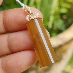 High Quality Brownish Yellow Natural Type A Jadeite Jade crafted as Nothing set on 18k Gold as Pendant certificate weighs 4.49 grams measurement 35 * 10.2 * 6.2 mm (18kp59)