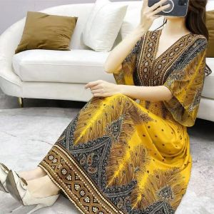 ชุดเดรสคอวีแขนสั้นผ้าไหมฝ้ายพิมพ์ลายสไตล์ชาติพันธุ์ฤดูร้อนสำหรับผู้หญิง ชุดเดรสยาวคลุมเข่าสำหรับใส่ไปเที่ยวในช่วงวันหยุด