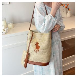 Womens 2025 New Summer Large Capacity Woven Raffia Bucket Bag Underarm Commuter Tote Bag Soft Surface Magnetic Buckle Closure