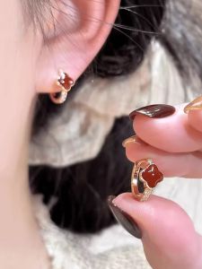 Red Four-leaf Clover Earrings Womens New 2025 Unique Design S925 Silver Needle Ear Clip Fashionable New Years Jewelry