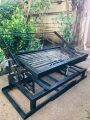 ROTATING BARBEQUE GRILL W/ FOLDABLE STAND. 