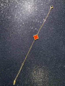 At its heart lies a shimmering star-shaped charm
