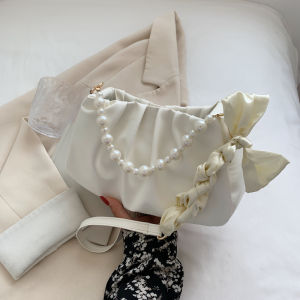 กระเป๋าสะพายข้างผู้หญิงแบบใหม่ปี 2023 กระเป๋าสะพายข้างแบบสะพายข้างด้านข้างด้วยน้ำมันไข่มุกแฟชั่นฤดูร้อน กระเป๋าสะพายข้างแบบนุ่ม