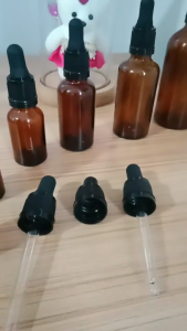 Amber glass dropper with black cap