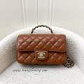 (Brand new) Chanel 23A Mini Rectangle Flap with Crystals Top Handle in Cognac Brown Lambskin and LGHW. 