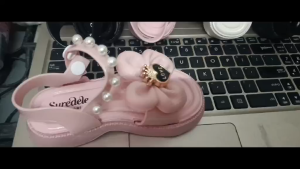 Kids Fashion Sandals with decorative studs and straps suitable for casual wear displayed on a pink platform.