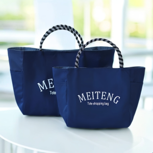 กระเป๋าถือแบบพกพาสำหรับเดินทาง กระเป๋าใส่อาหาร กระเป๋าถือกันน้ำสีพื้น กระเป๋าแม่แบบอเนกประสงค์สำหรับเดินทางไปทำงานในชีวิตประจำวัน