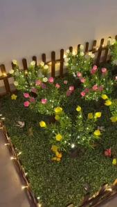 Gardenia Solar Flower Stake Pink Buds and Green Foliage with LED Accents for Wedding Entrances