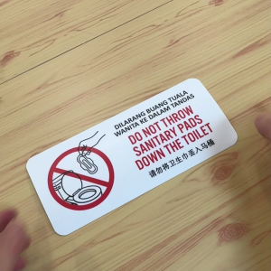 Do Not Throw Sanitary Pads Down The Toilet. Dilarang Buang Tuala Wanita Ke Dalam Tandas 请勿将卫生巾丢入马桶. Sticker Sign Signage