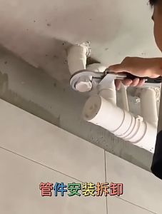 Multi-functional adjustable wrench for disassembling sanitary ware and pipe sleeve