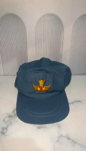 topi abu abu sma dengan logo tut wuri handayani