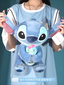 New Stitch plush toy Stitch holding little golden doll