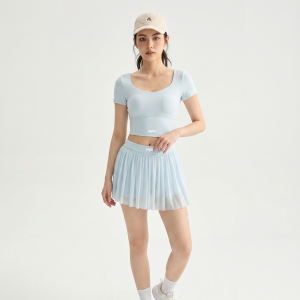 Light blue pleated tennis skirt set with built-in shorts crisscross back athletic skort for woMan yoga gym.