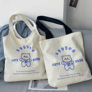 กระเป๋าผ้าใบลายการ์ตูนสำหรับสาวนักศึกษา กระเป๋าสะพายไหล่ผู้หญิง กระเป๋าใส่หนังสือสไตล์เกาหลี กระเป๋าสะพายไหล่แบบลำลอง