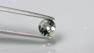 50 ชิด พลอยแท้ พลอยเขียวส่อง 2 สี เผาเก่า สีเขียว เหลือง ทรงกลม บางกะจะ