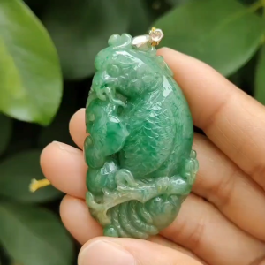 Green Natural Type A Jadeite Jade crafted with Parrot with Ruyi and Coin as Pendant ceritificate weighs 22.55 grams measurement 54.6 * 30 * 9.2 mm (pendant332)