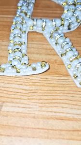 Hình kết cườm may lên áo trang trí