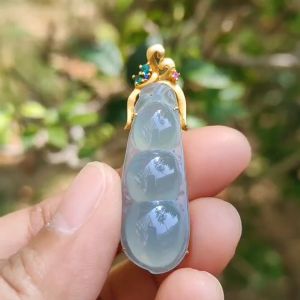Icy Translucent Premium Quality Natural Type A Jadeite Jade crafted as Bean set on 18k Gold as Pendant certificate weighs 5.31 grams measurement 40.6 * 12 * 8 mm (18kp52)