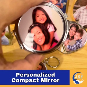 Compact mirror with personalized photo insert. Silver metallic finish. Fits in hand. Ideal for personal use.