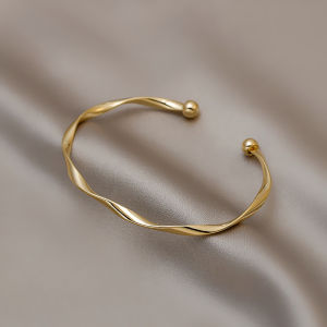 Classic Premium Retro Style Twisted Metal Bracelet for Women Gold twisted design with spherical ends Elegant jewelry piece for fashion accessories