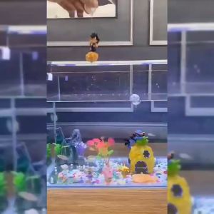 Mô hình songoku bay trong bể cá thủy sinh