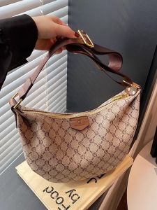 อินเทรนด์ ขนาดใหญ่ผู้หญิงใต้วงแขนกระเป๋า 2025 ใหม่สไตล์แฟชั่นเกี๊ยวกระเป๋าสบายๆกว้าง สายคล้อง กระเป๋ากระเป๋าสะพายข้างสำหรับสุภาพสตรี