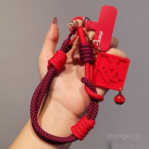 จี้โทรศัพท์มือถือแบบสั้นปีใหม่จี้แขวนข้อมือสไตล์ชาติพันธุ์สีแดง สายป้องกันการสูญหายแบบถอดได้สำหรับทั้งชายและหญิง