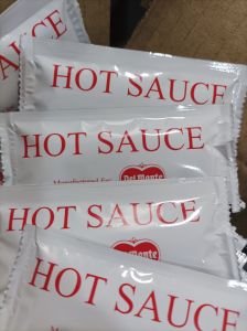 Del monte Hot Sauce 7g - White packets - Red text - Condiment - Cooking sauce